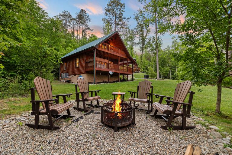 Cabin with outdoor fire pit and chairs