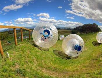 two giant inflatable balls in a field